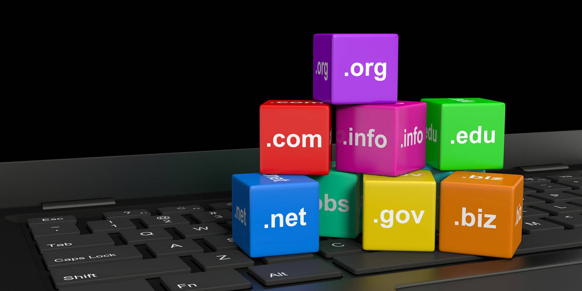 Internet Domain Names Cubes on a Laptop Computer Keyboard 3D Illustration